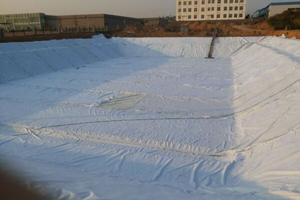 The geotextile cushion should be laid on a clean base surface